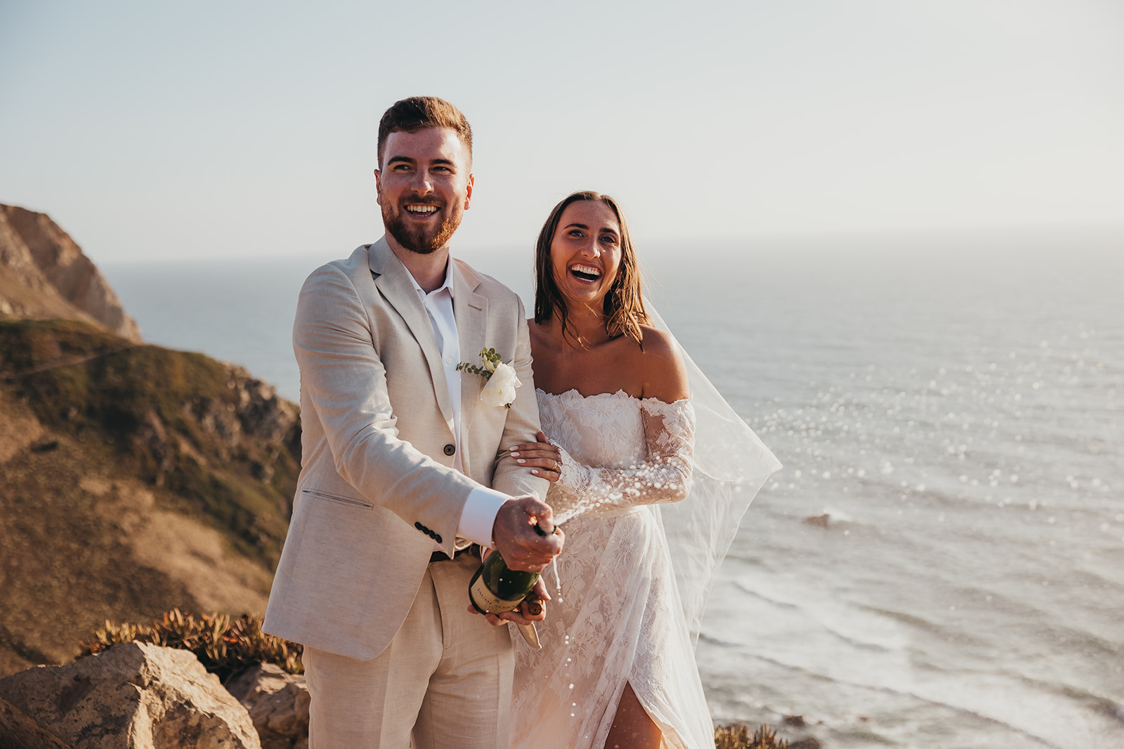 A couple happily celebrating their destination wedding in Portugal