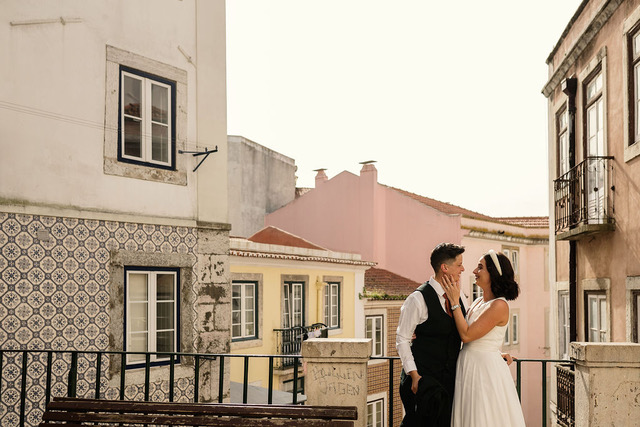 Man wearing a white t-shirt featuring a dark, grayscale graphic print of a man in a fedora smoking indoors, styled like a film noir illustration